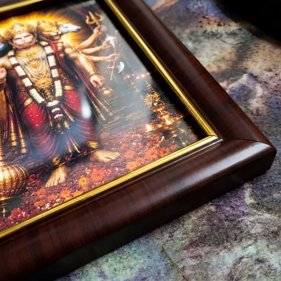 Close-up angled view of the Panchmukhi Hanuman Ji artwork, highlighting the glossy protective finish, rich gold inner border, and premium dark wood frame texture.